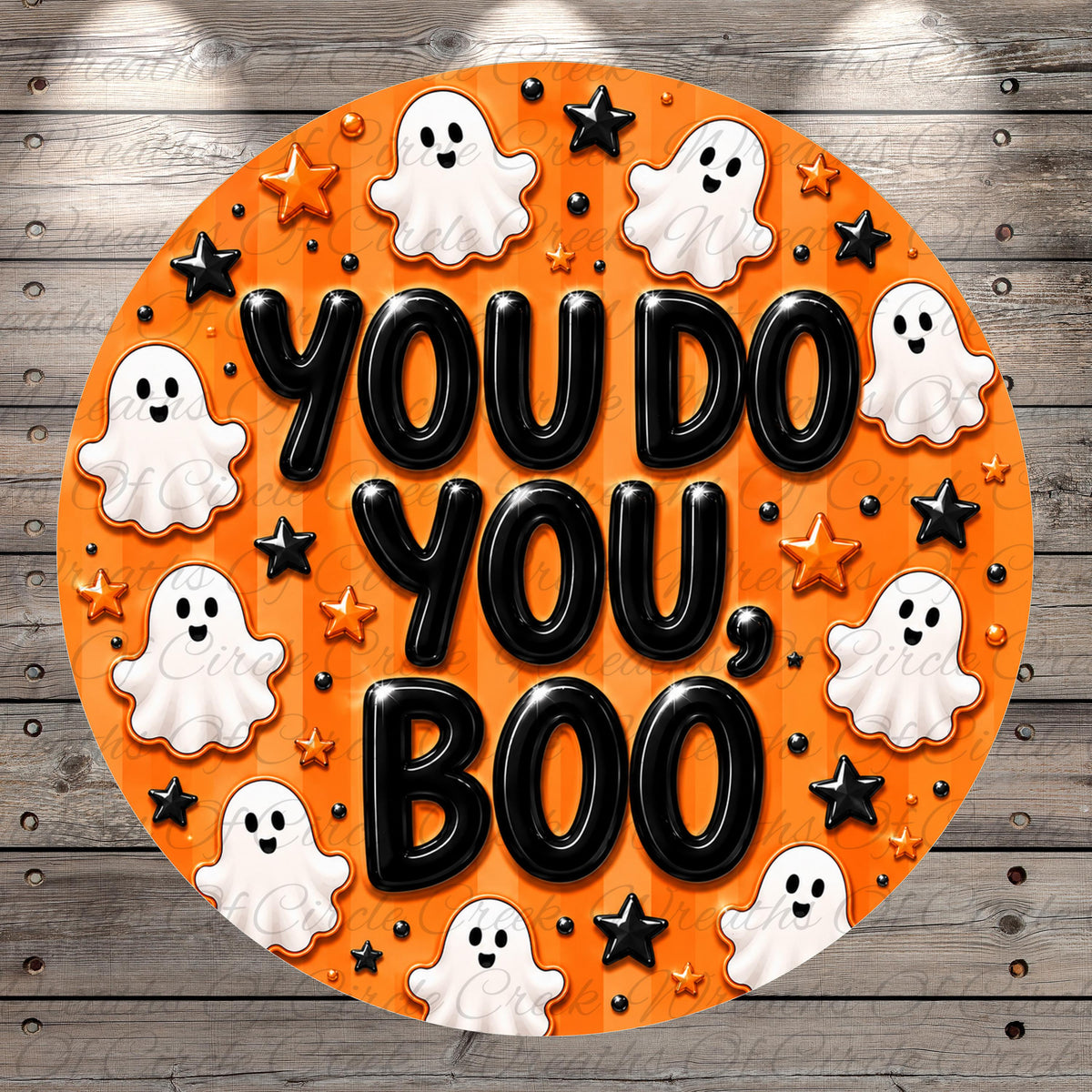 a circular design with the text "YOU DO YOU BOO" surrounded by ghostly figures and stars in an orange and black color scheme.
