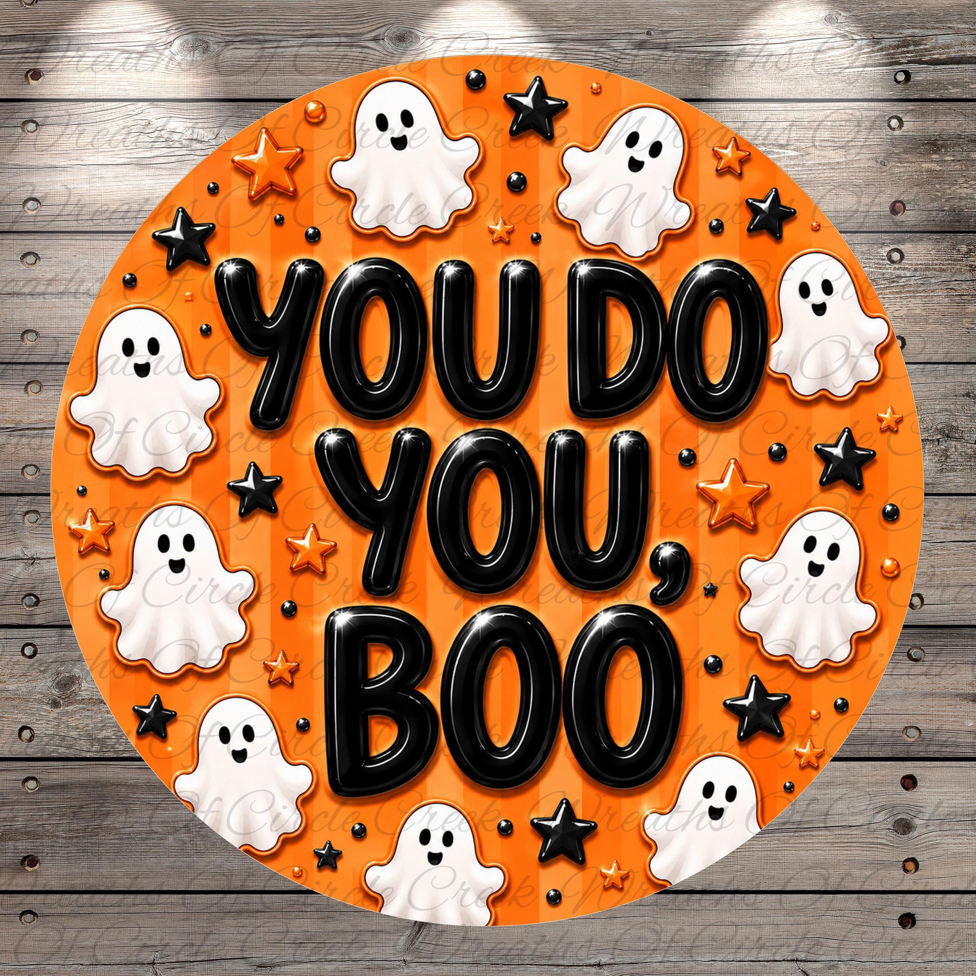 a circular design with the text "YOU DO YOU BOO" surrounded by ghostly figures and stars in an orange and black color scheme.
