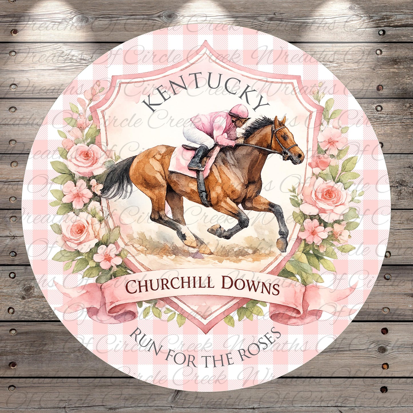 A round sign featuring a horse and rider, with the text "Kentucky Churchill Downs" and "Run for the Roses" written on it. The sign is surrounded by pink flowers and a pink and white checkered pattern.