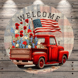 a red pickup truck with an American flag displayed on the back, surrounded by a floral arrangement.