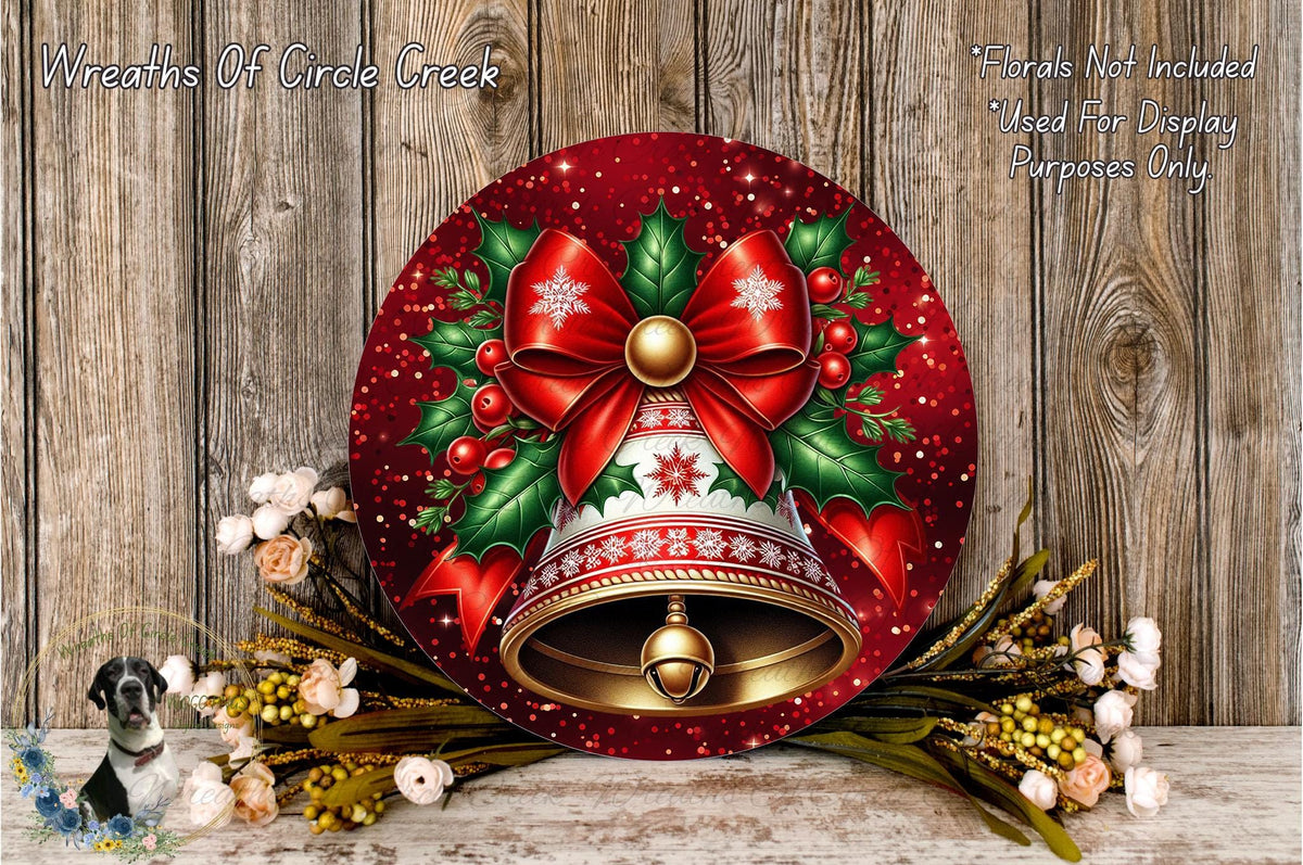 a festive Christmas-themed wreath with a bell at the center, surrounded by a variety of flowers and greenery. The wreath is displayed on a wooden surface, creating a warm and holiday atmosphere.