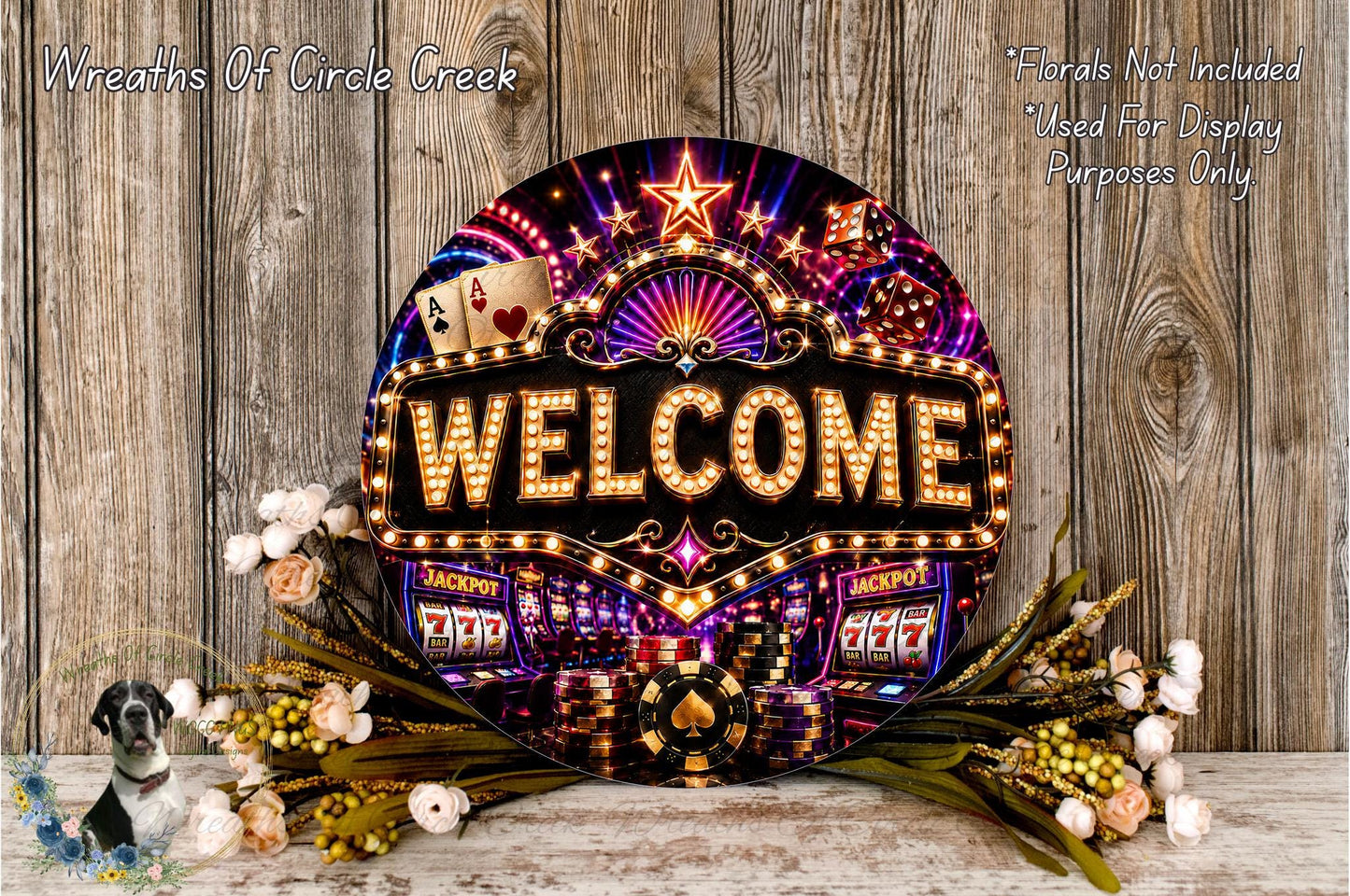 a large, illuminated sign that says "Welcome" with various casino-themed elements such as slot machines, poker chips, and flowers surrounding it.