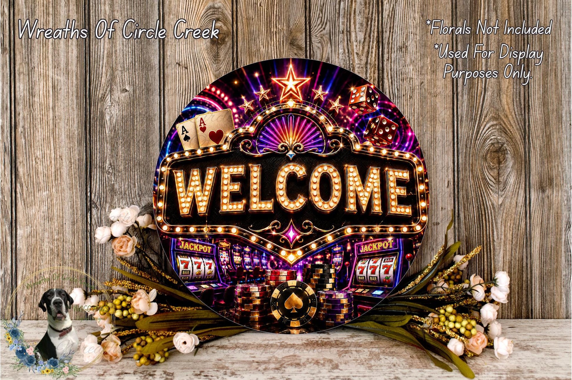 a large, illuminated sign that says "Welcome" with various casino-themed elements such as slot machines, poker chips, and flowers surrounding it.