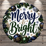 A circular arrangement of Christmas ornaments, greenery, and the text "Merry & Bright" against a wooden background.