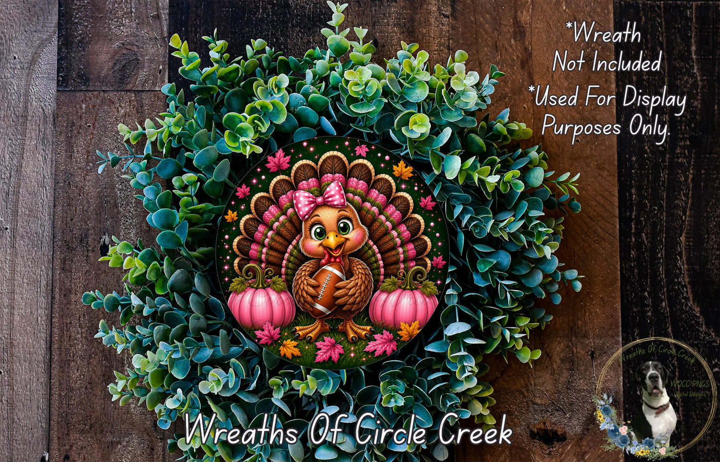 A wreath featuring a cartoon turkey holding a football, surrounded by green foliage and two pumpkins, with a wooden background.
