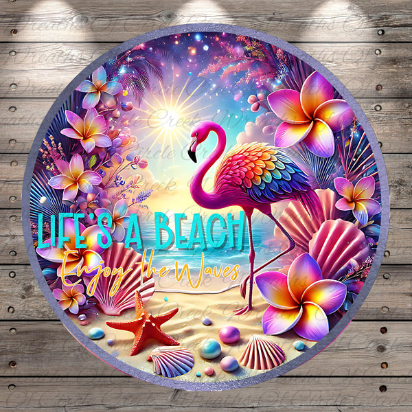 A vibrant and colorful illustration of a flamingo surrounded by tropical flowers, shells, and a beach scene, with the text "Life's a Beach Enjoy the Waves" prominently displayed.