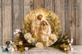 A decorative wreath featuring the image of the Holy Family, with the mother, father, and baby Jesus surrounded by flowers and greenery.