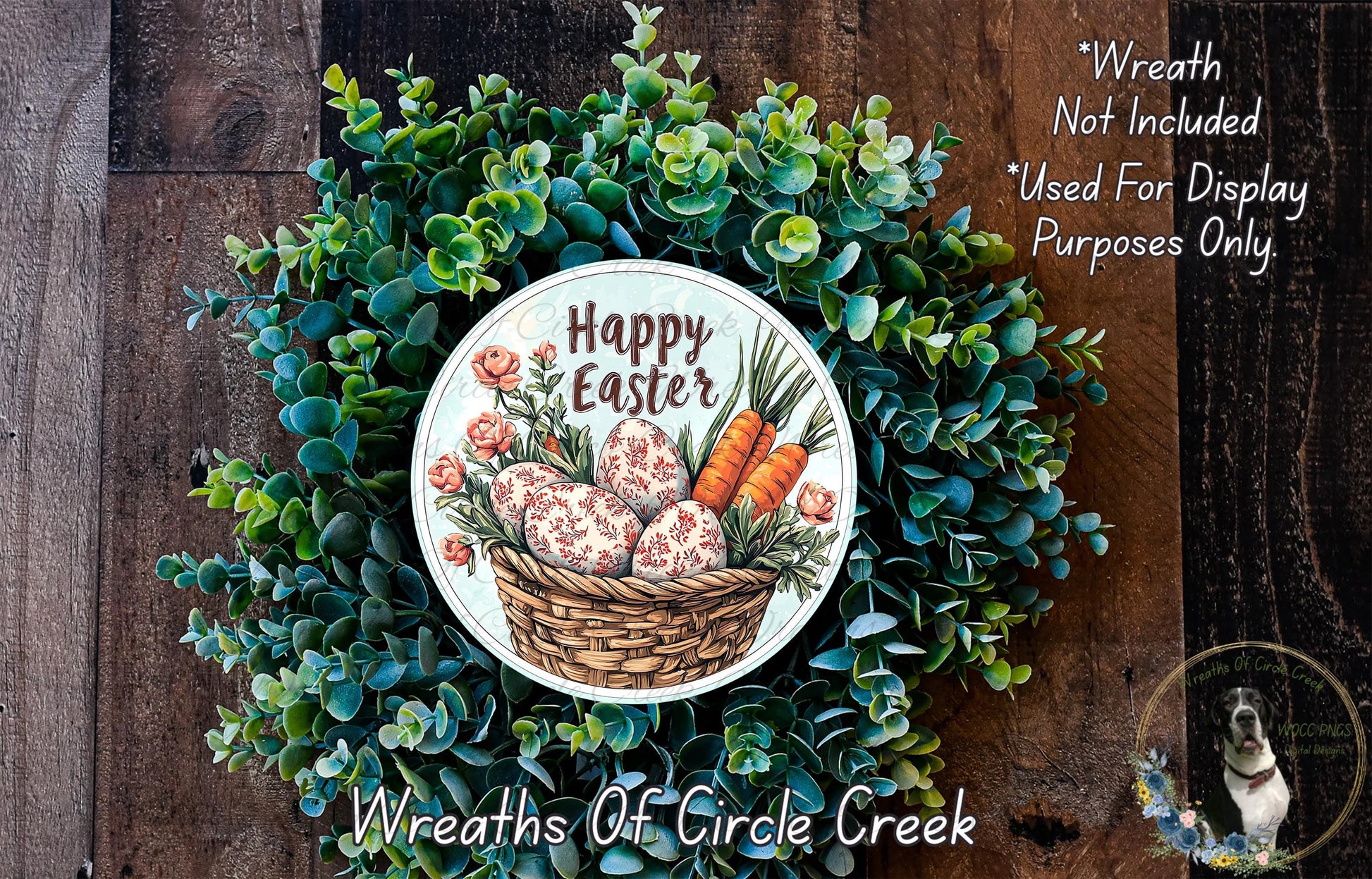a wreath made of green foliage and decorated with a basket of Easter eggs and carrots. The wreath is displayed on a wooden surface, and there is a text overlay that reads "Happy Easter" and "Wreath Not Included * Used For Display Purposes Only".