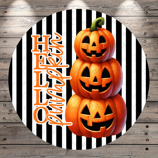 A Halloween-themed image featuring three jack-o'-lanterns stacked on top of each other against a striped background.