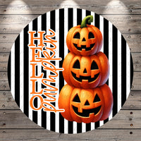 A Halloween-themed image featuring three jack-o'-lanterns stacked on top of each other against a striped background.