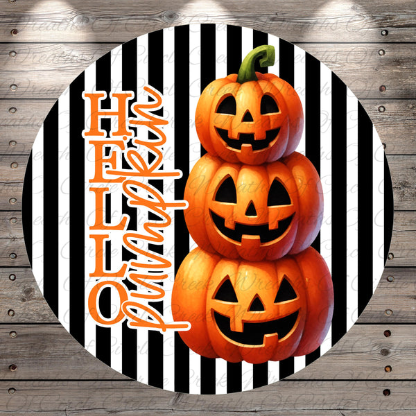 A Halloween-themed image featuring three jack-o'-lanterns stacked on top of each other against a striped background.