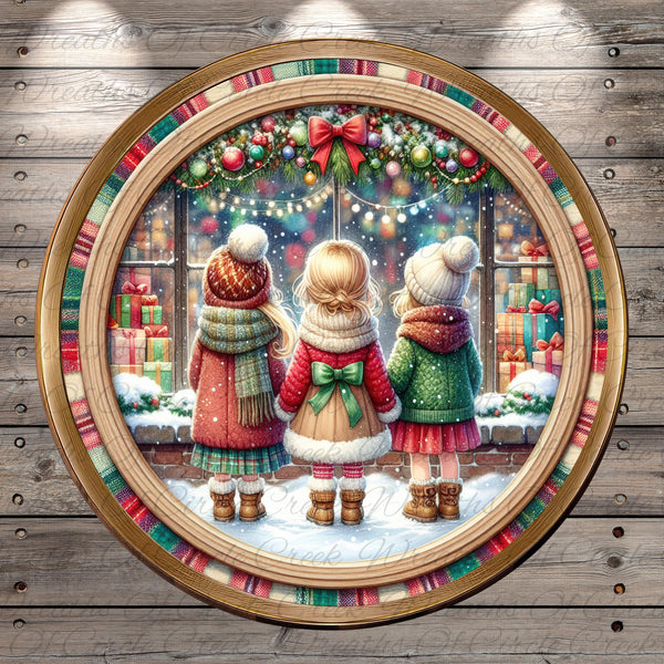 A festive Christmas scene featuring three children standing in front of a window decorated with Christmas lights and ornaments.