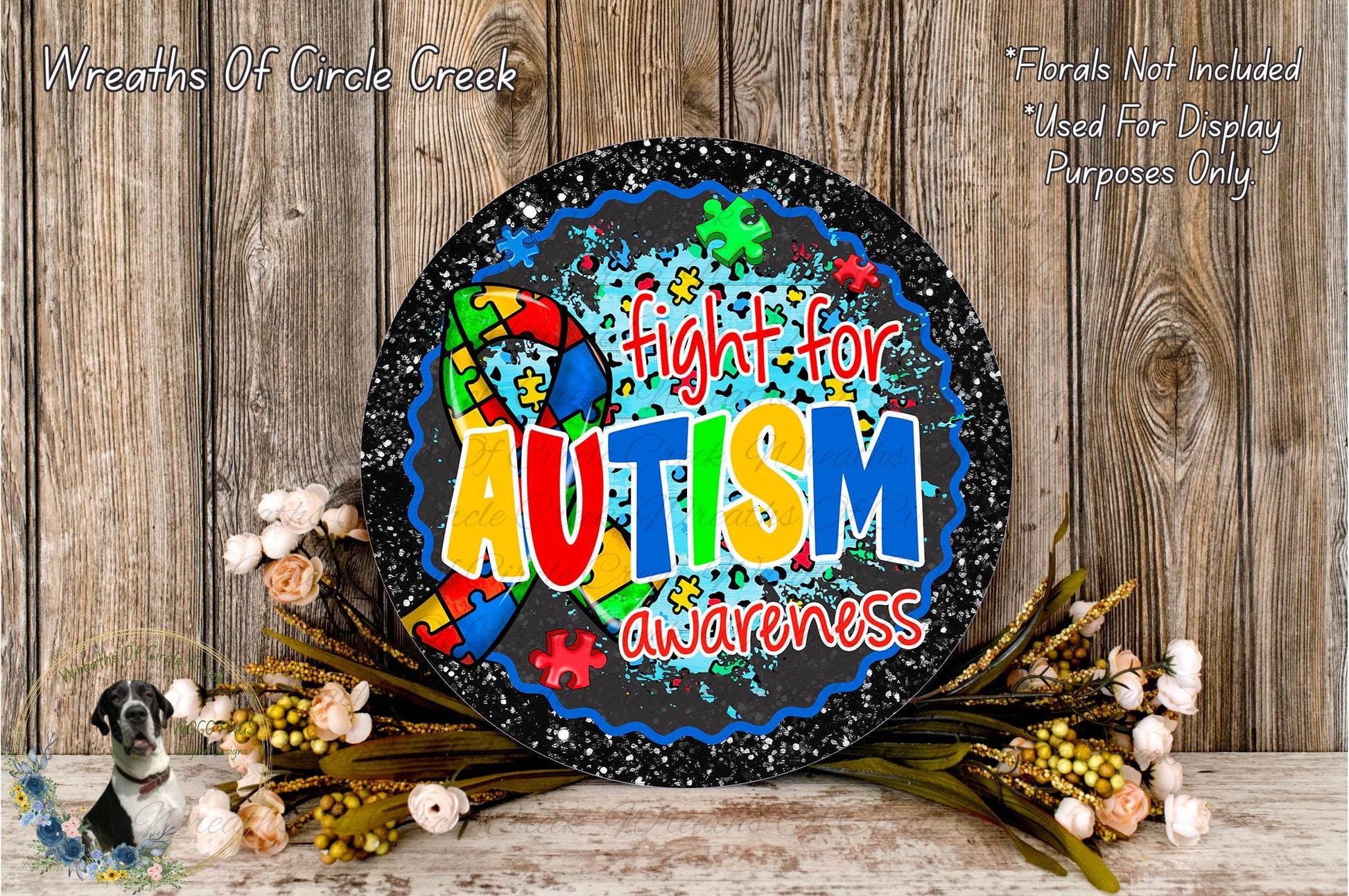 A black and white sign with a colorful design, featuring the text "Fight for Autism awareness" surrounded by puzzle pieces and flowers.