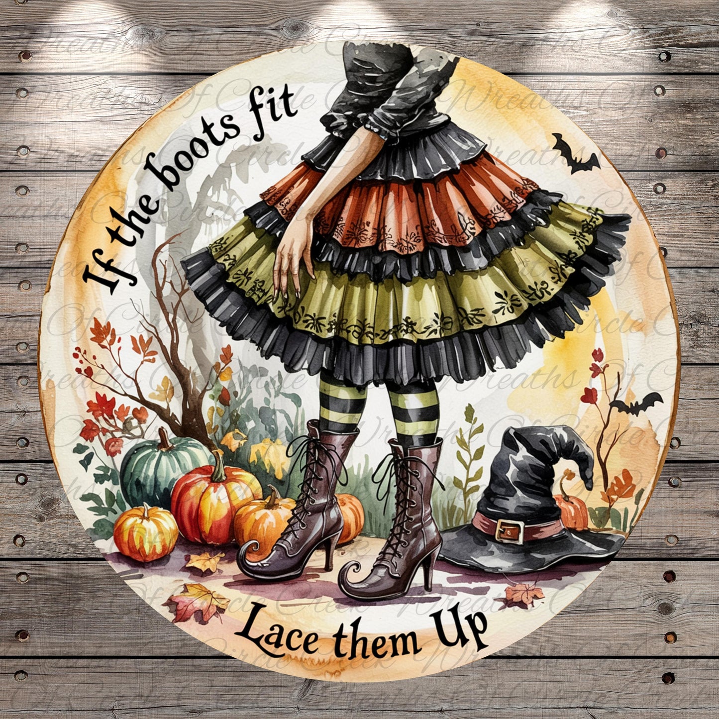 A whimsical illustration of a witch in a colorful, ruffled dress standing in a garden surrounded by pumpkins, bats, and a witch's hat. The text "If the boots fit, lace them up" is displayed around the witch, suggesting a playful or humorous message.
