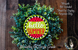A wreath made of green and red leaves, with a large circular sign that says "Hello Summer" in the center.