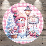 A cheerful snowman wearing a pink hat and scarf, holding a basket of candy canes, stands next to a lamp post with a "Happy Holidays" sign. The background features a snowy landscape with trees and a lamppost.