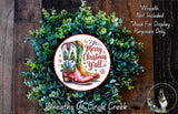 a wreath made of green foliage and a pair of red cowboy boots, with the text "Merry Christmas Y'all" displayed on the wreath.