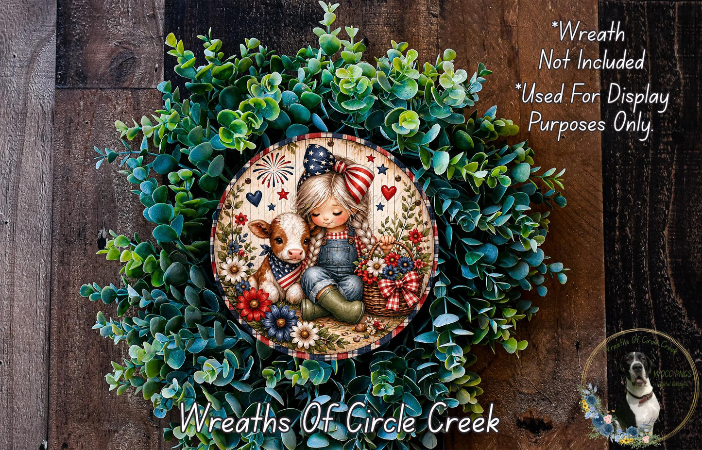 a wreath with a young girl and a cow, surrounded by green foliage. The wreath is displayed on a wooden surface, and there is a text overlay that reads "Wreath Not Included * Used For Display Purposes Only".