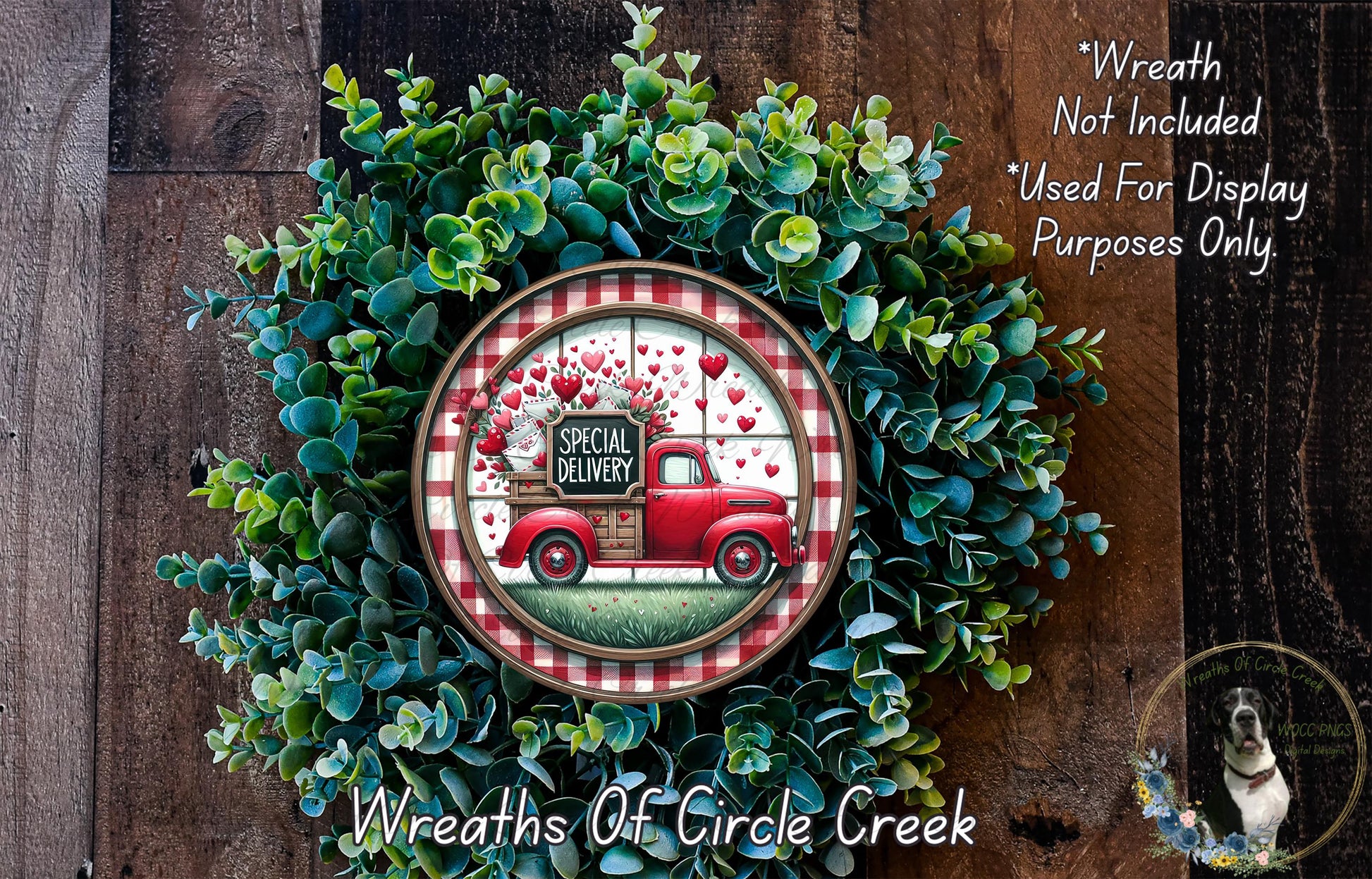A wreath made of green foliage and a red truck with a "Special Delivery" sign on it, placed on a wooden surface.