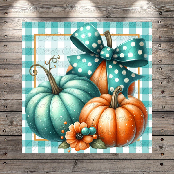 A decorative arrangement of turquoise pumpkins with polka dot bows and orange pumpkins, set against a blue and white checkered background.