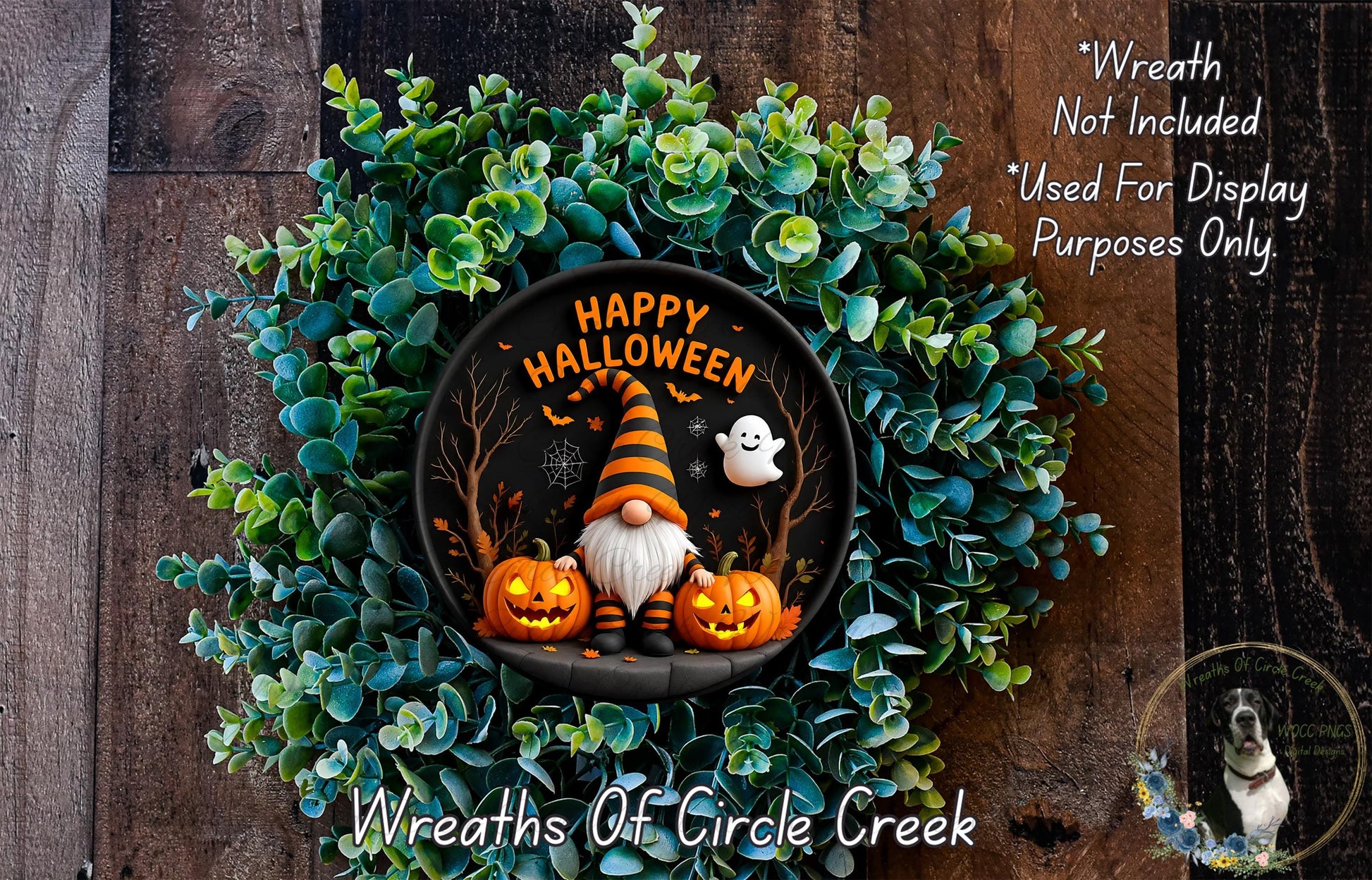 A Halloween-themed wreath made of green foliage and featuring a gnome, pumpkins, and a ghost. The wreath has the text "Happy Halloween" and "Wreath Not Included" written on it.