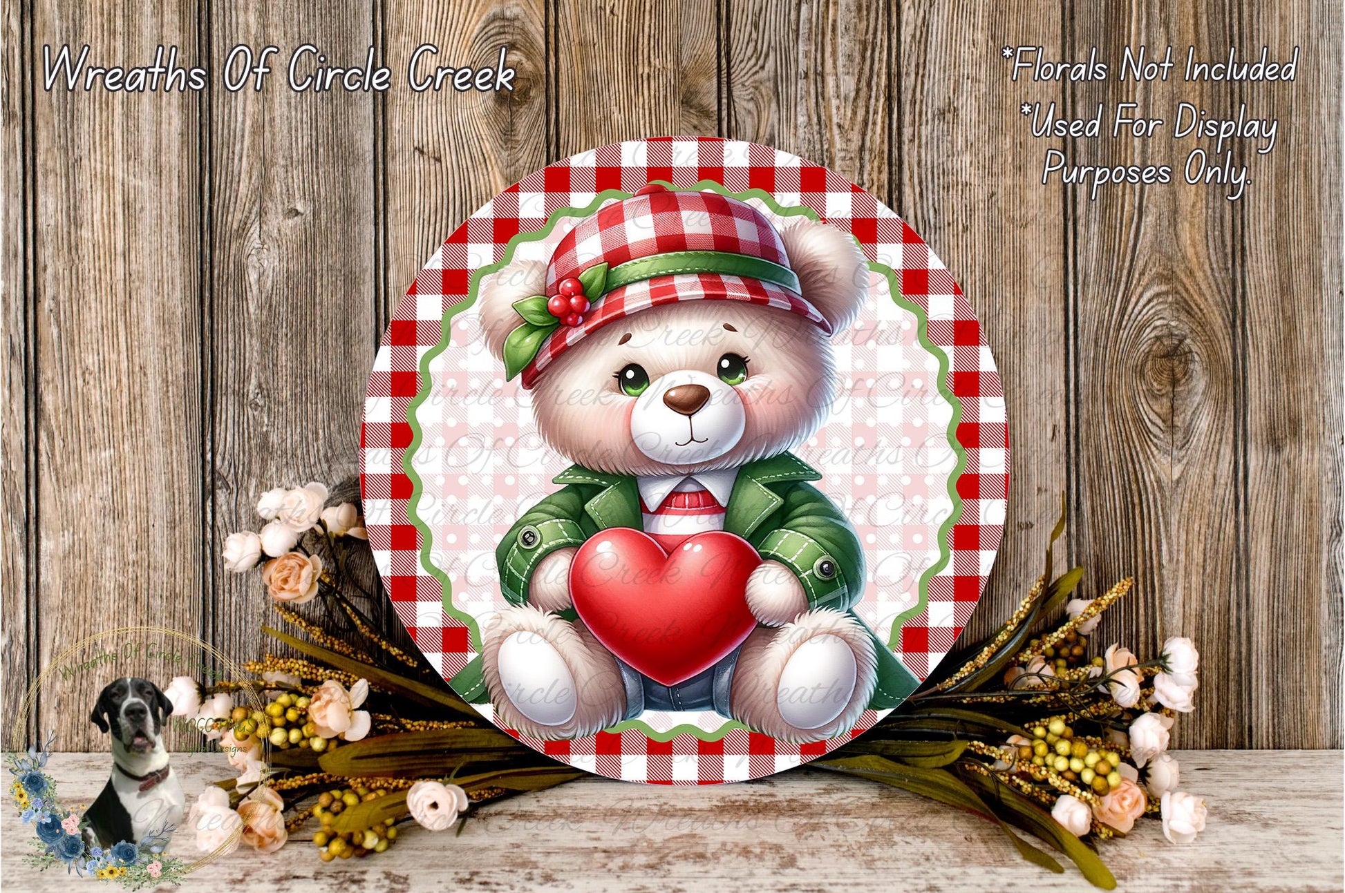 A round decorative plate featuring a white teddy bear holding a red heart, surrounded by a floral arrangement and a wooden background.