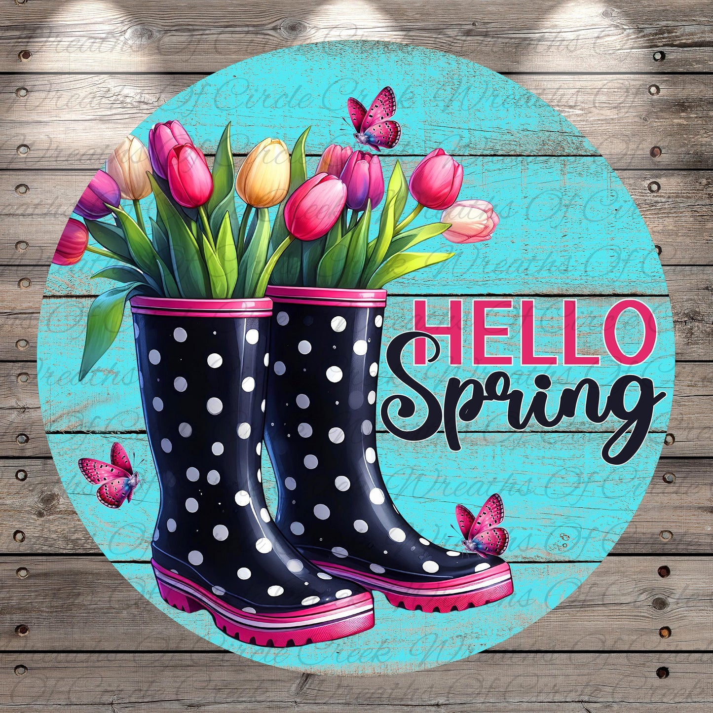 A circular design featuring a pair of black and pink polka dot rain boots, with a bouquet of pink and yellow tulips inside the boots. Butterflies are also present in the image.