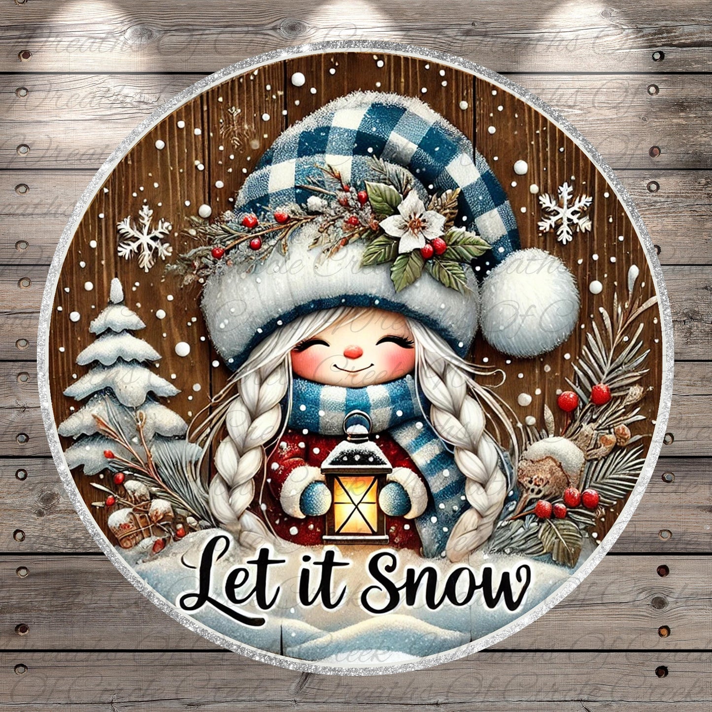 A round, wooden sign with a smiling girl wearing a blue and white hat and holding a lantern, surrounded by snowflakes, pine trees, and berries. The sign has the text "Let it Snow" written on it.
