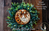 a wreath with a bow and sunflowers on it