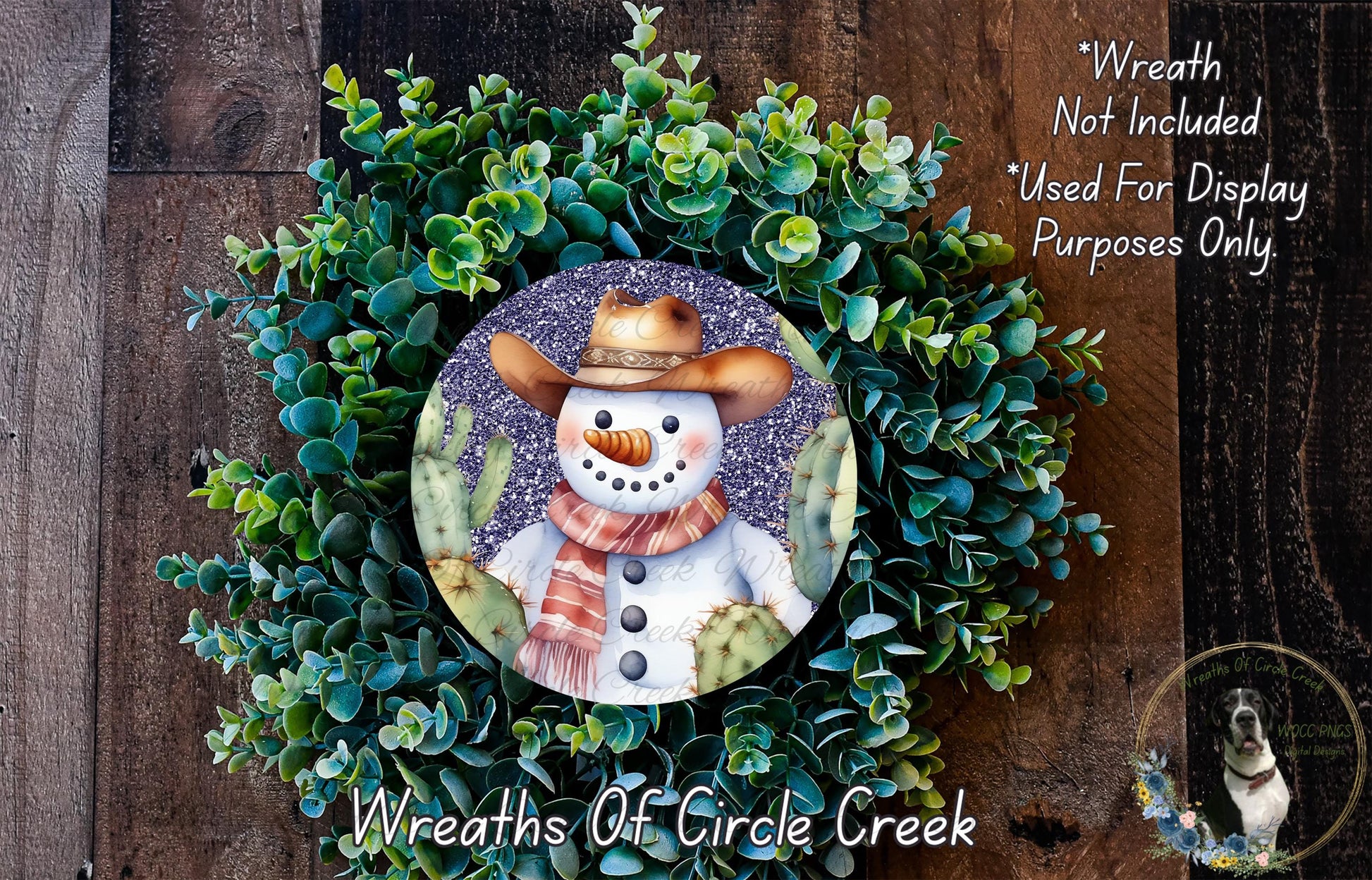 A wreath featuring a snowman wearing a cowboy hat and scarf, surrounded by green succulent plants.