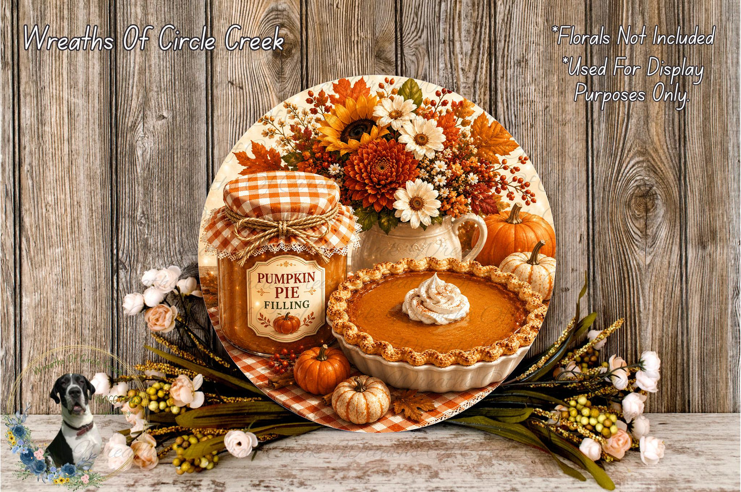 a decorative arrangement of autumn-themed items, including a pumpkin pie, a jar of pumpkin pie filling, a vase of fall flowers, and a wooden platter with a pie. The arrangement is set against a rustic wooden background, creating a warm and cozy atmosphere.