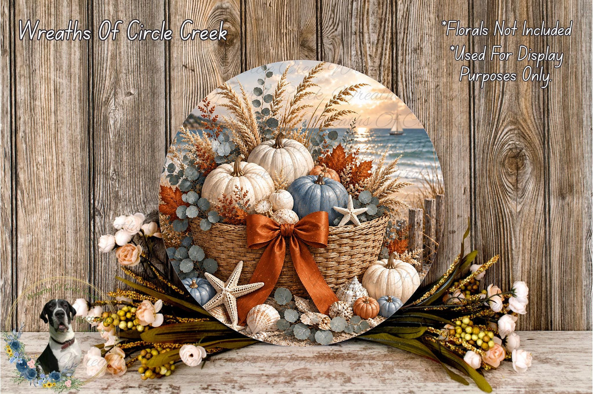 A circular wreath made of various fall-themed elements, including pumpkins, leaves, and flowers, displayed on a wooden surface.