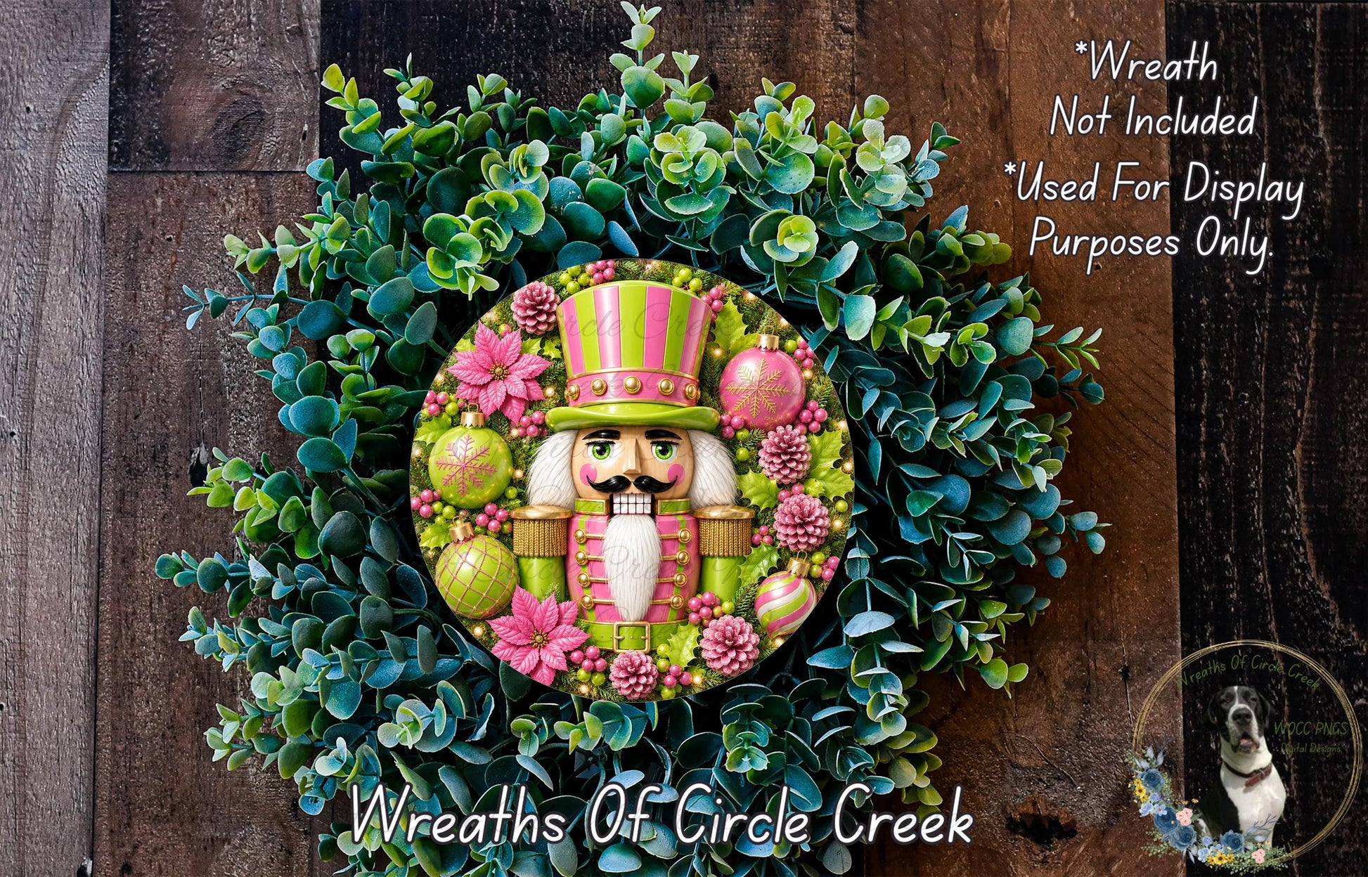 A wreath made of green and pink flowers, with a nutcracker figure in the center, is displayed on a wooden surface.