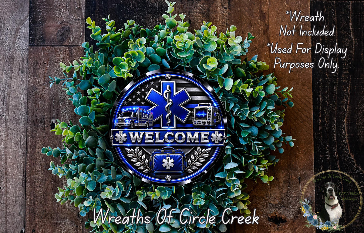 a wreath with a blue and silver design, surrounded by green foliage. The wreath has a welcome sign with the word "WELCOME" and a medical symbol, indicating it is a decoration for a healthcare-related event or space.