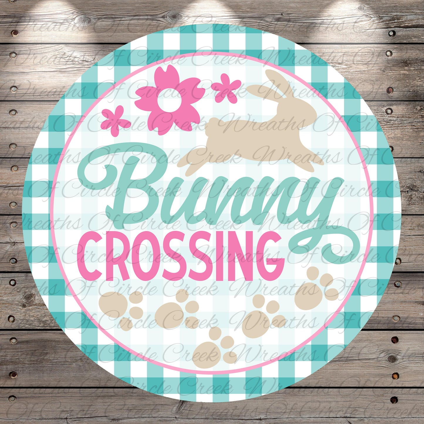 The image is a round sign with the text "Bunny Crossing" written on it, surrounded by a checkered border and a pink flower design.