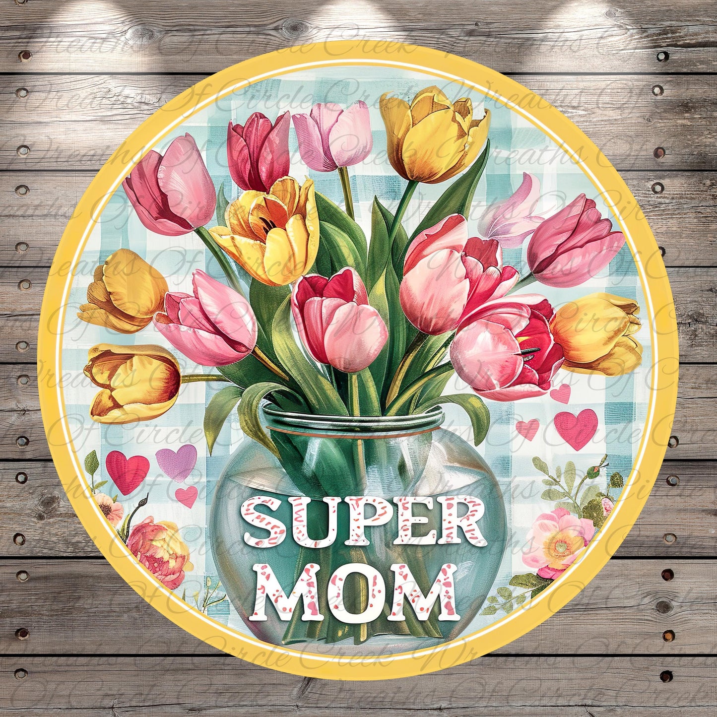 A round sign with a vase of colorful tulips and the text "SUPER MOM" written on it.