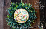 a wreath with a bunny and Easter eggs, surrounded by greenery. The text on the wreath indicates that it is not included in a display and is used for purposes only.