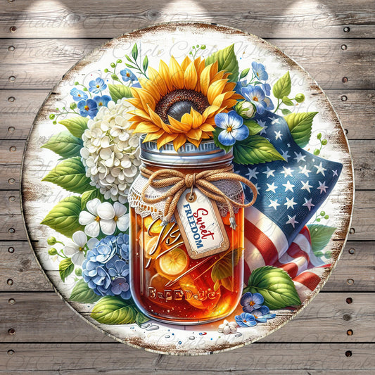 A round, wooden plate with a jar of honey surrounded by flowers, including a sunflower, hydrangeas, and bluebells. The jar has a "Sweet Freedom" label.