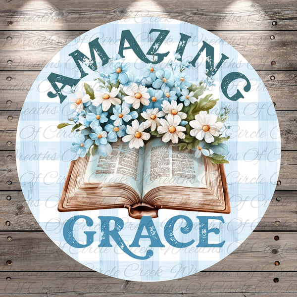 an open book with a bouquet of blue and white flowers resting on top of it, surrounded by the text "Amazing Grace".