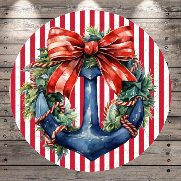 A circular wreath with a blue anchor and red ribbon, surrounded by greenery and red and white stripes.