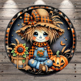 A whimsical illustration depicting a scarecrow-like character surrounded by autumn-themed elements, including a pumpkin, sunflowers, and a barrel.