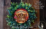 a wreath with a decorative border and a circular design in the center, surrounded by a lush green wreath. The wreath has a sign that says "Bienvenidos" and is displayed on a wooden background.