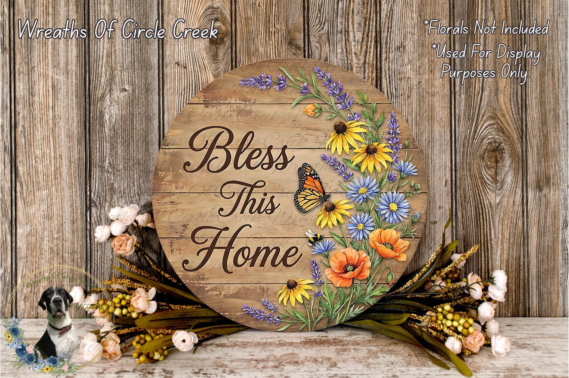 A wooden sign with the text "Bless This Home" surrounded by a floral arrangement and a butterfly.