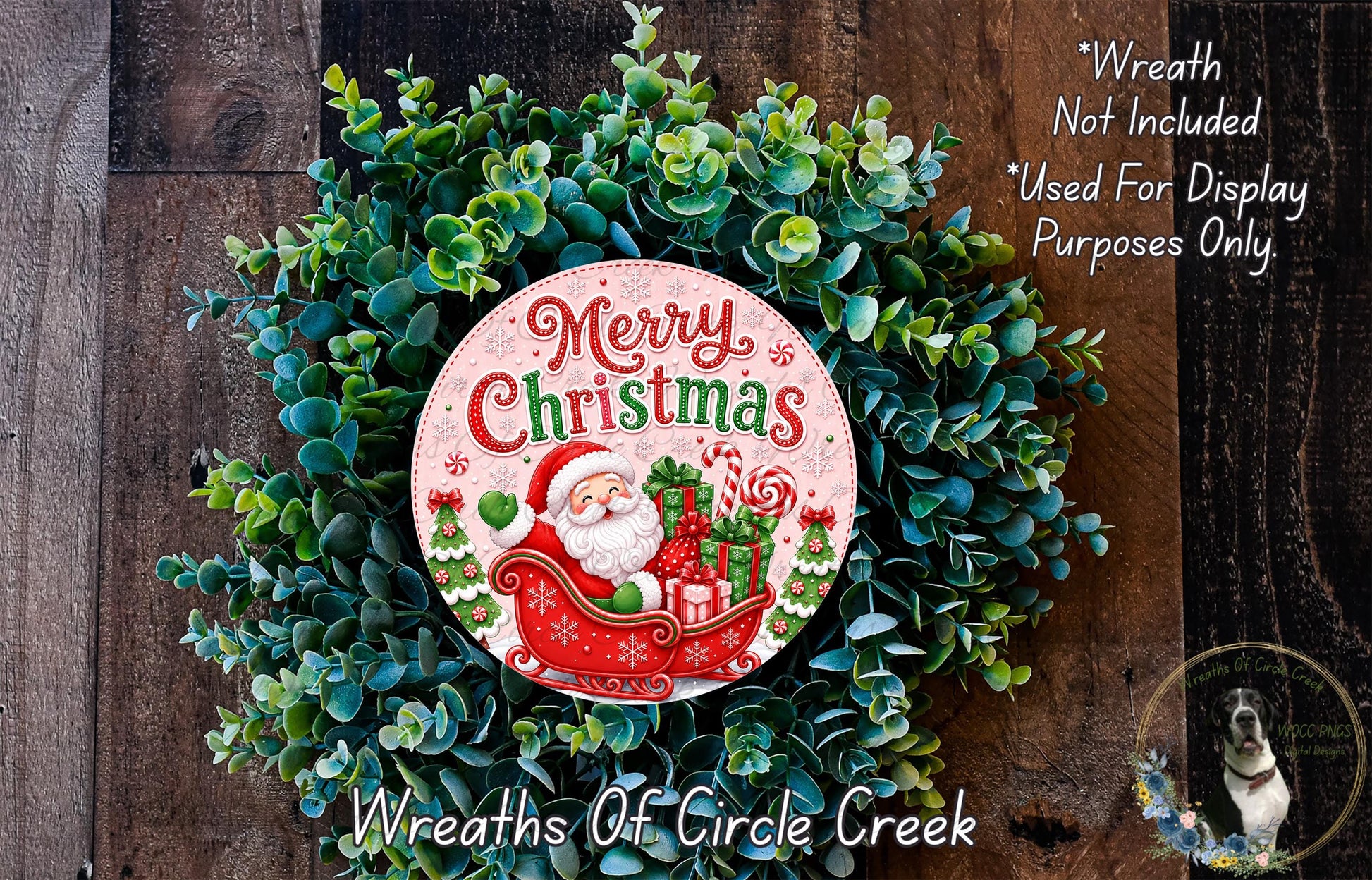 A Christmas wreath made of evergreen branches and featuring a Santa Claus image, with the text "Merry Christmas" displayed on the wreath.