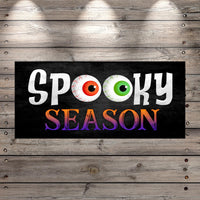 a sign that says spooky season on it