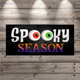 a sign that says spooky season on it