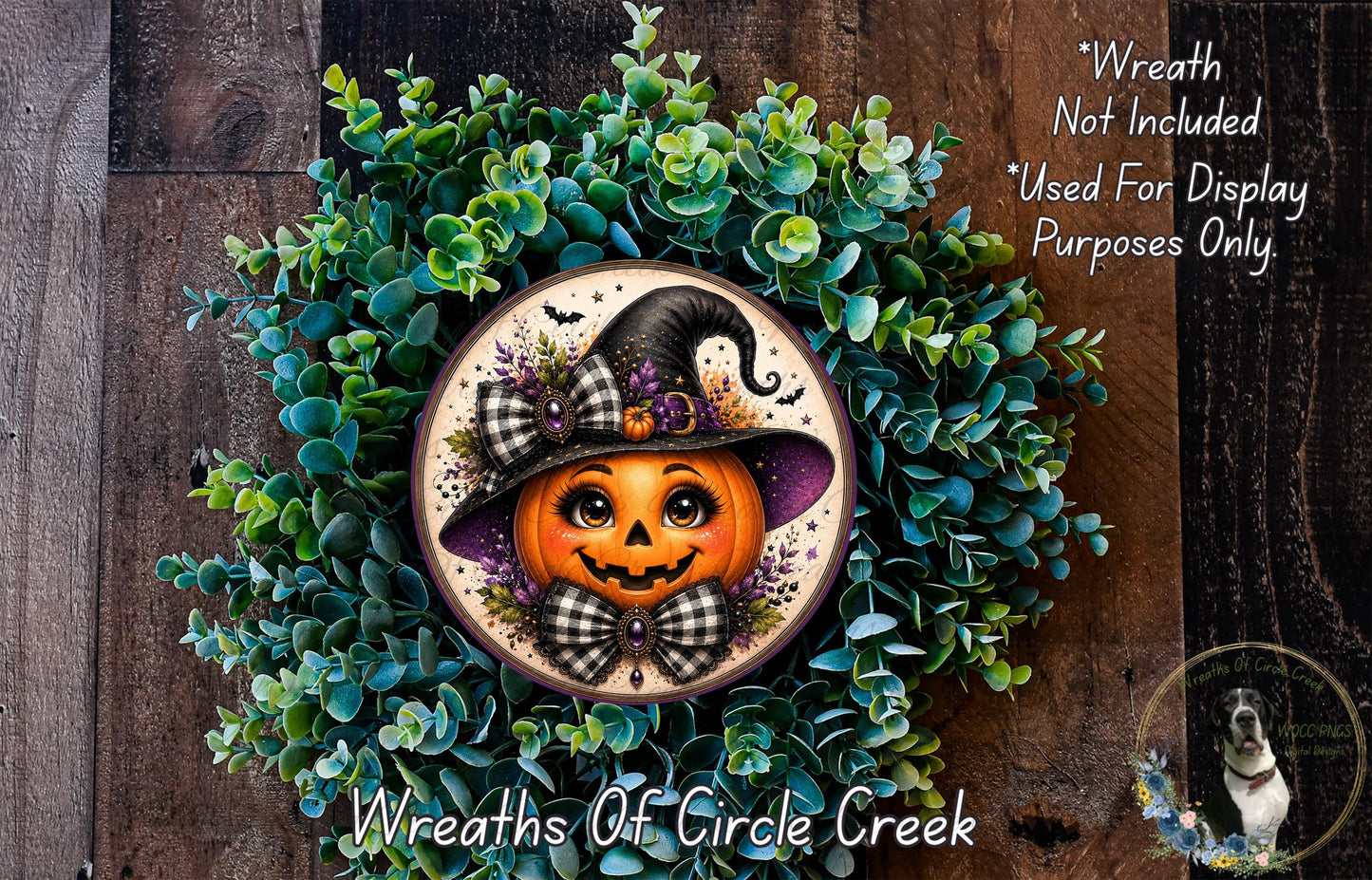 A Halloween-themed wreath featuring a pumpkin with a black witch's hat and a bow tie, surrounded by green foliage.