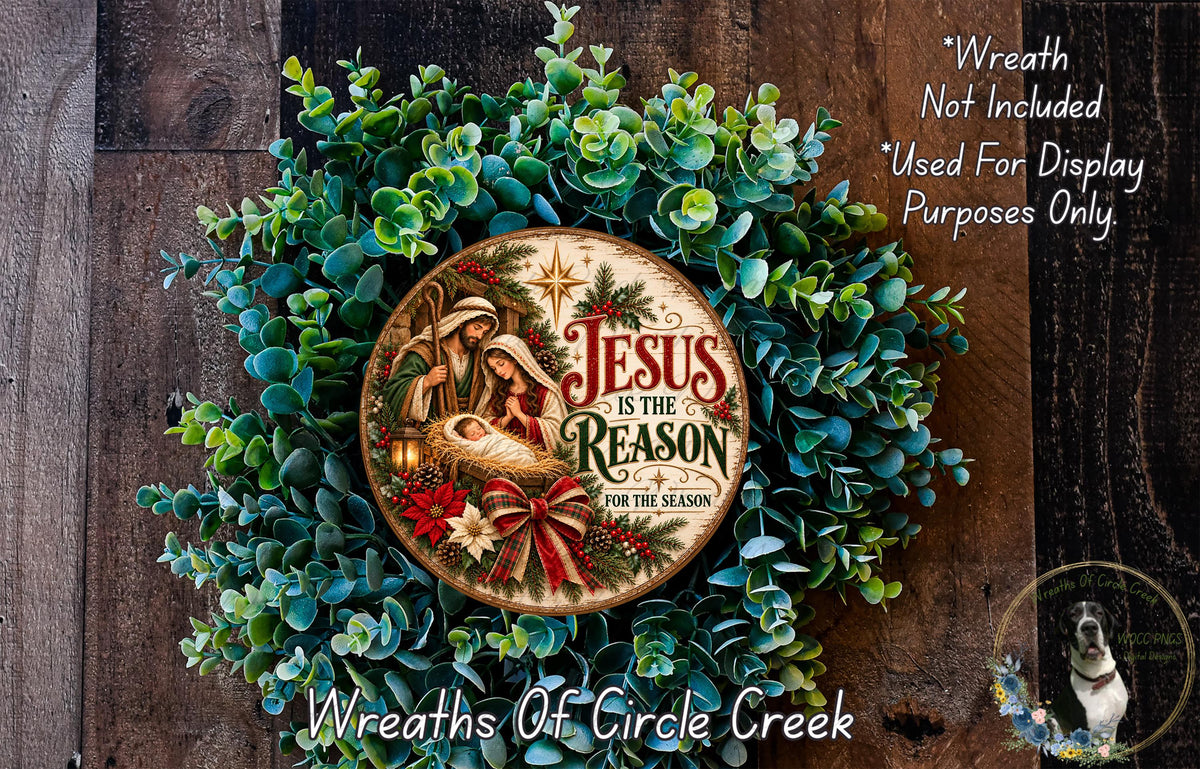 A wreath made of green leaves and flowers, with a circular sign in the center that reads "Jesus is the reason for the season".
