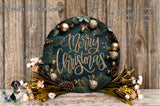 A festive Christmas wreath with the text &quot;Merry Christmas&quot; displayed on it, surrounded by various holiday decorations such as pine cones, pine branches, and ornaments. The wreath is placed on a wooden surface, and there are also some flowers and greenery surrounding it.