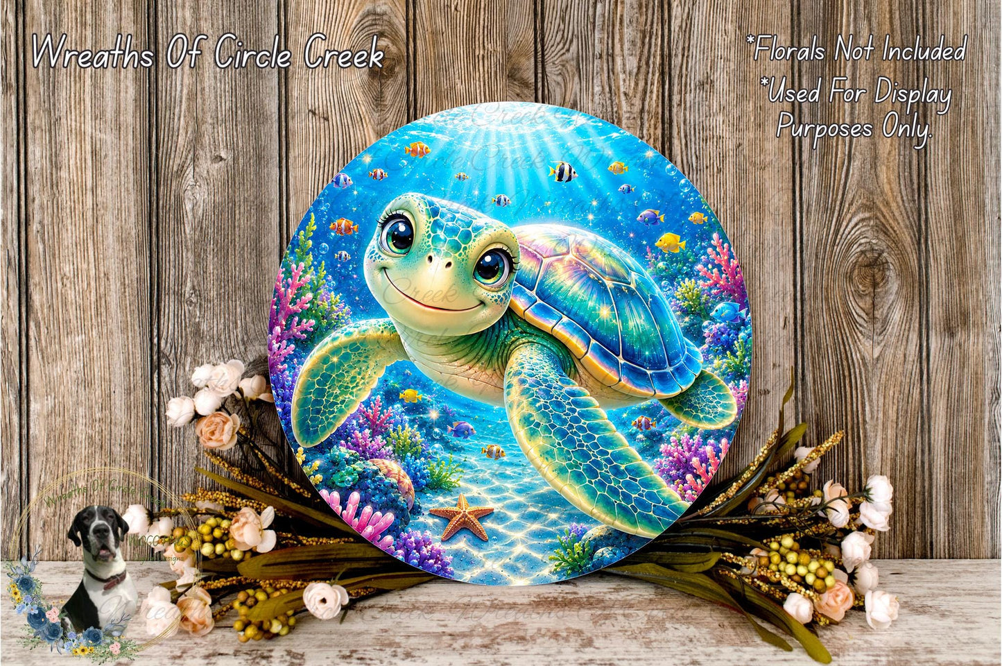 A round, colorful painting of a smiling sea turtle surrounded by a vibrant underwater scene, including coral, fish, and other marine life. The painting is displayed on a wooden surface, with a bouquet of flowers and a small bird figurine in the foreground.
